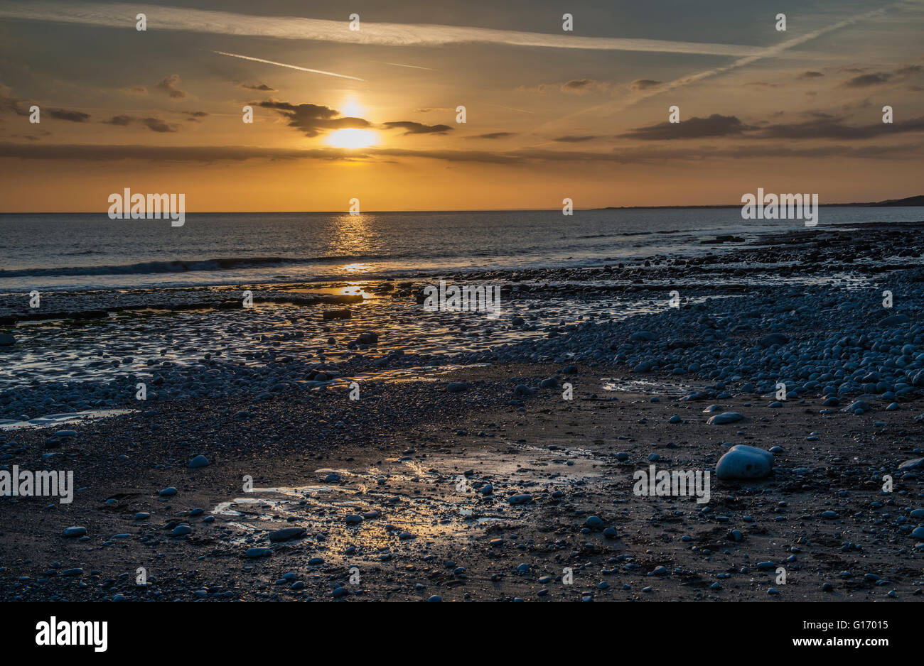 Setting Sun over the Bristol Channel from the Glamorgan Heritage Coast at Cwm Nash Beach, south Wales Stock Photo