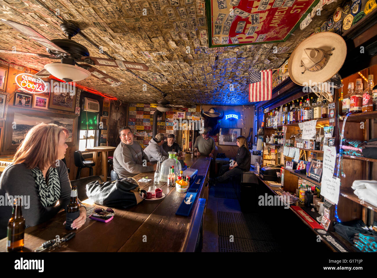 Patrons in the No Scum Allowed saloon in the historic town of White Oaks, New Mexico. Stock Photo