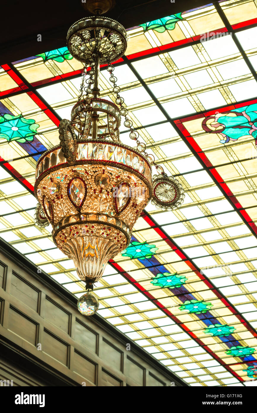 Chandelier and stained glass ceiling in the atrium of the historic Geiser Grand Hotel in Baker City, Oregon. Stock Photo