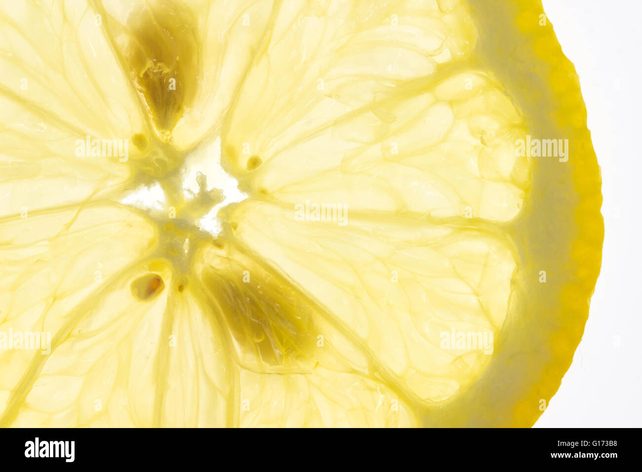 Slice of fresh lemon isolated on white background Stock Photo - Alamy