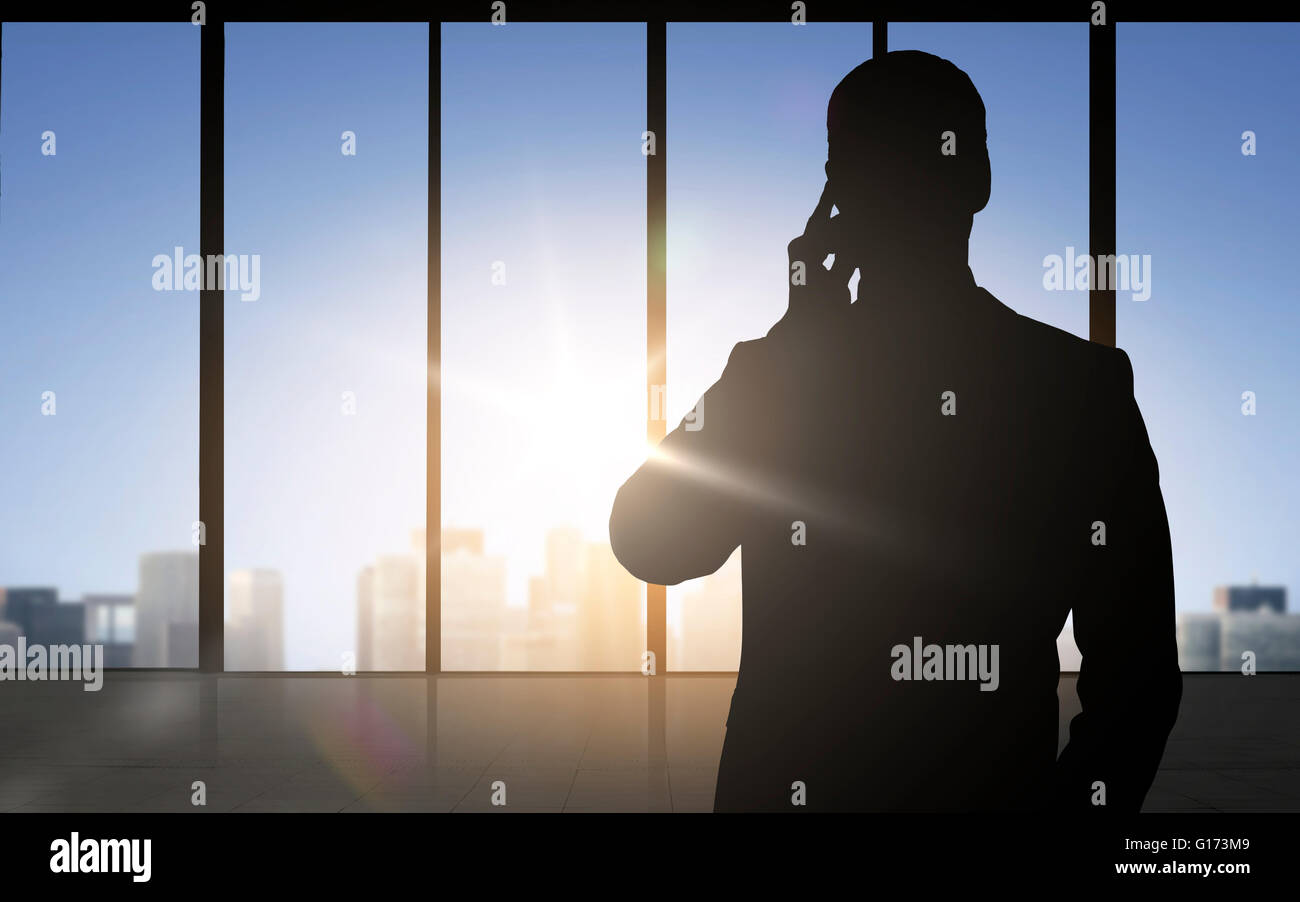 silhouette of business man calling on smartphone Stock Photo