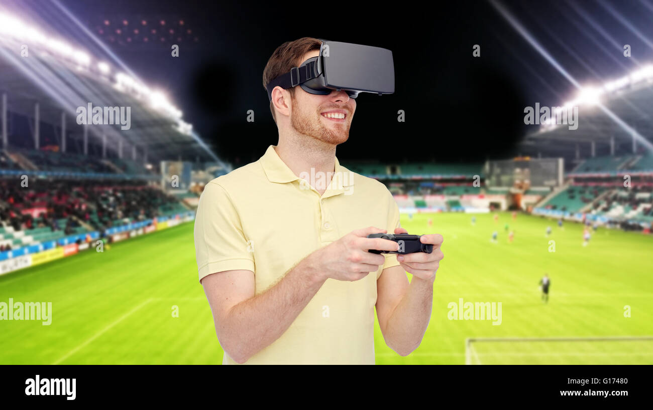 man in virtual reality headset over football field Stock Photo Alamy
