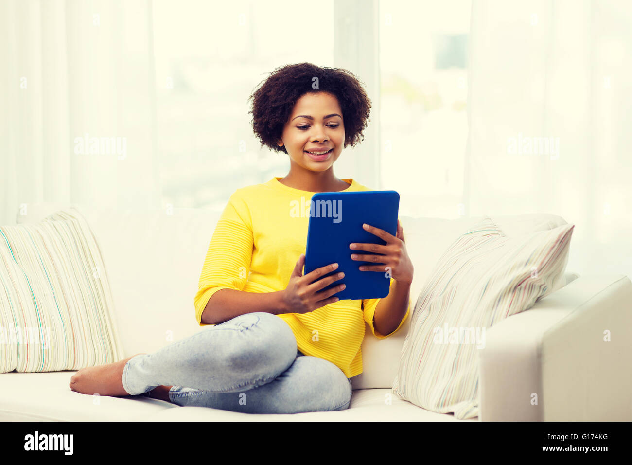 happy african american woman with tablet pc Stock Photo - Alamy