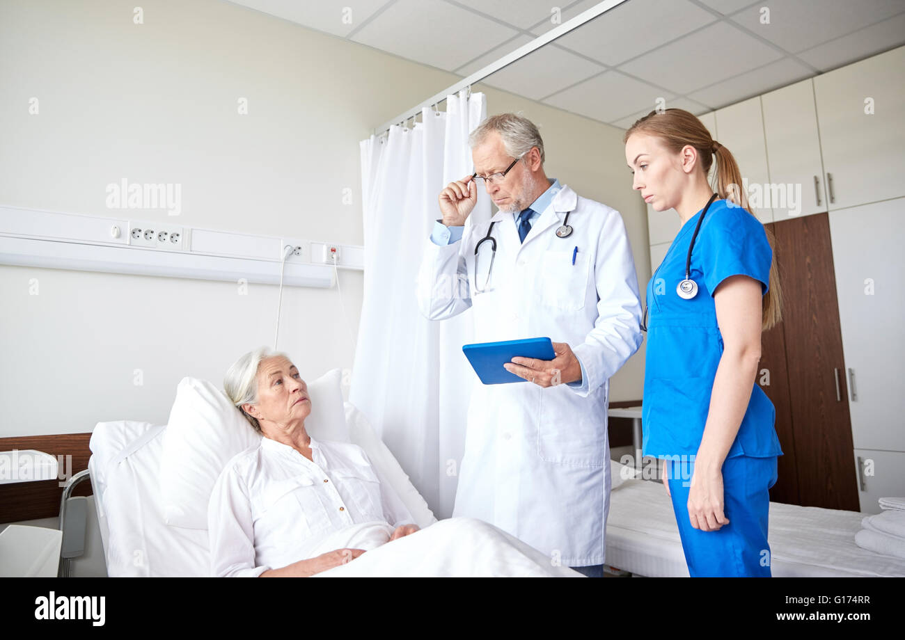doctor and nurse visiting senior woman at hospital Stock Photo - Alamy