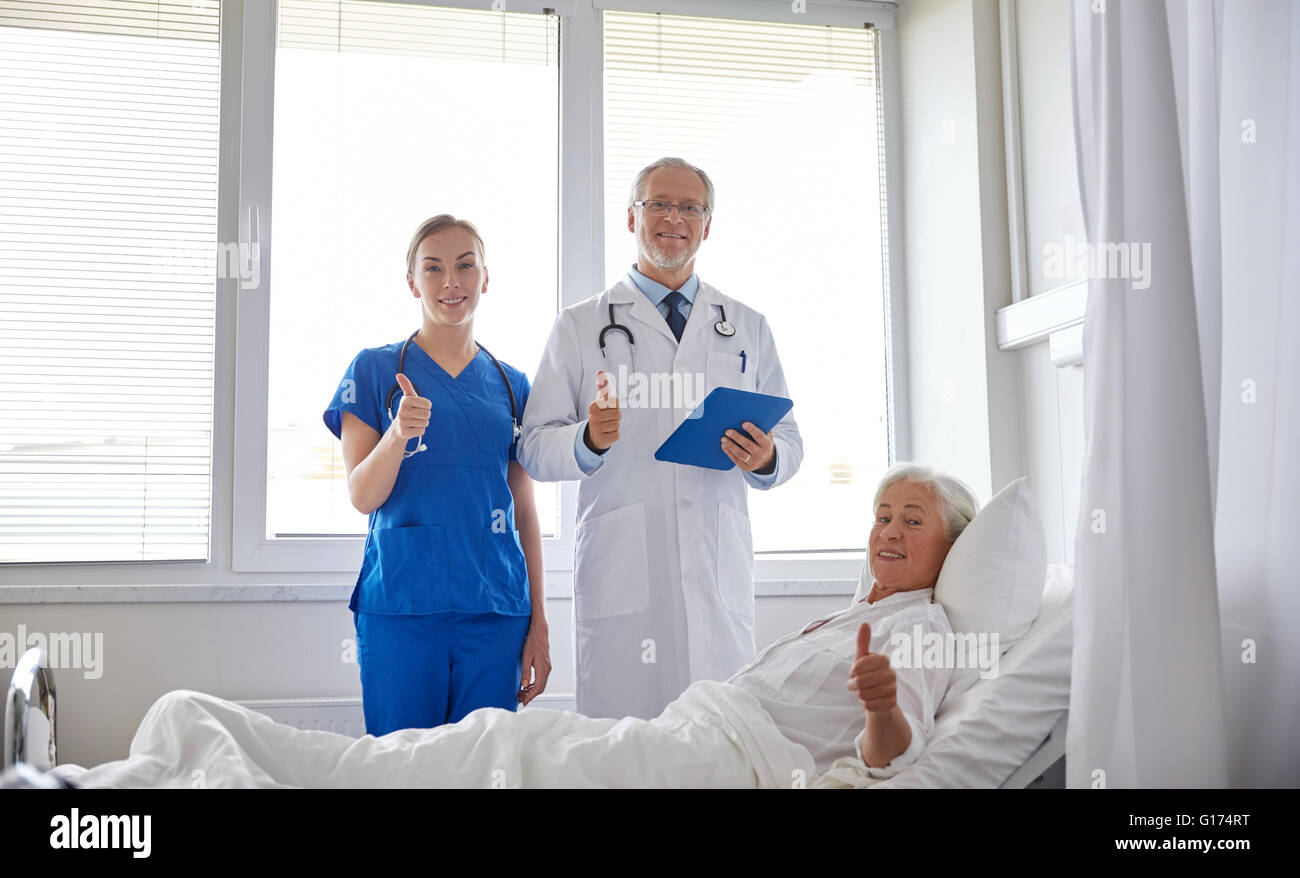 doctor and nurse visiting senior woman at hospital Stock Photo - Alamy