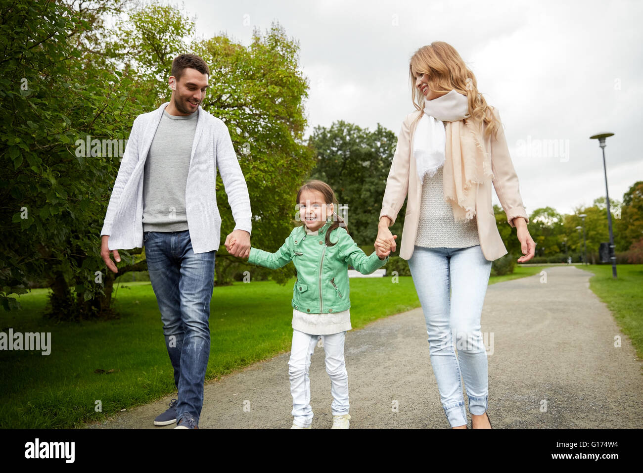 happy family walking in summer park Stock Photo - Alamy