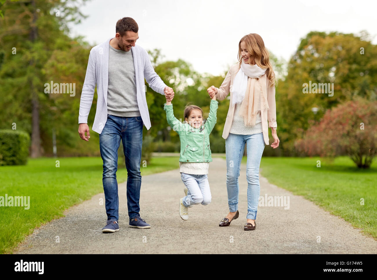happy family walking in summer park and having fun Stock Photo - Alamy