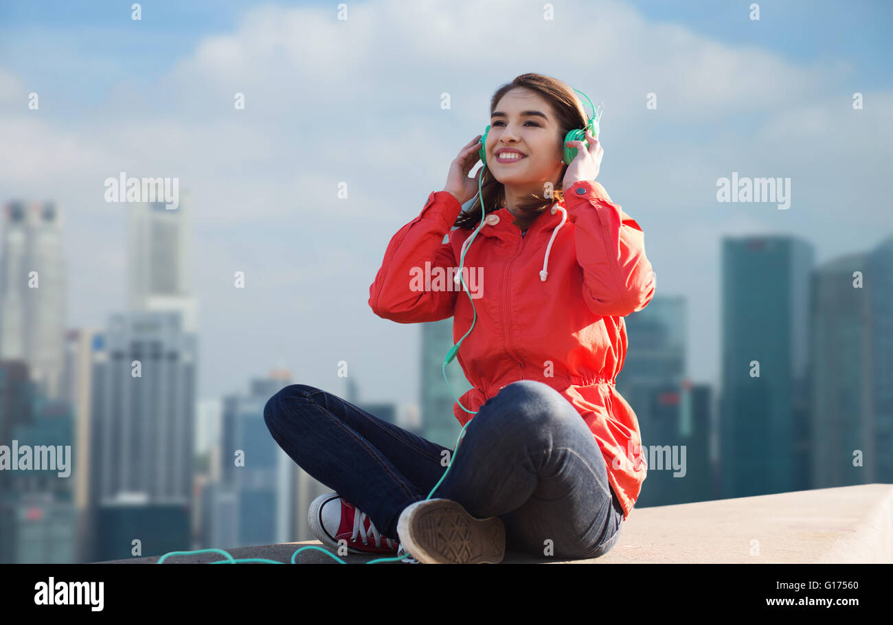 happy young woman in headphones listening to music Stock Photo - Alamy
