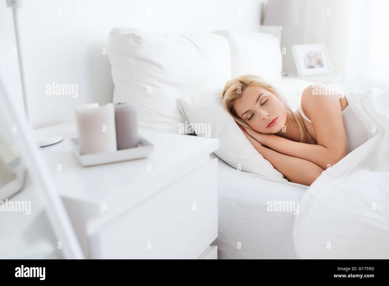 young woman sleeping in bed at home bedroom Stock Photo