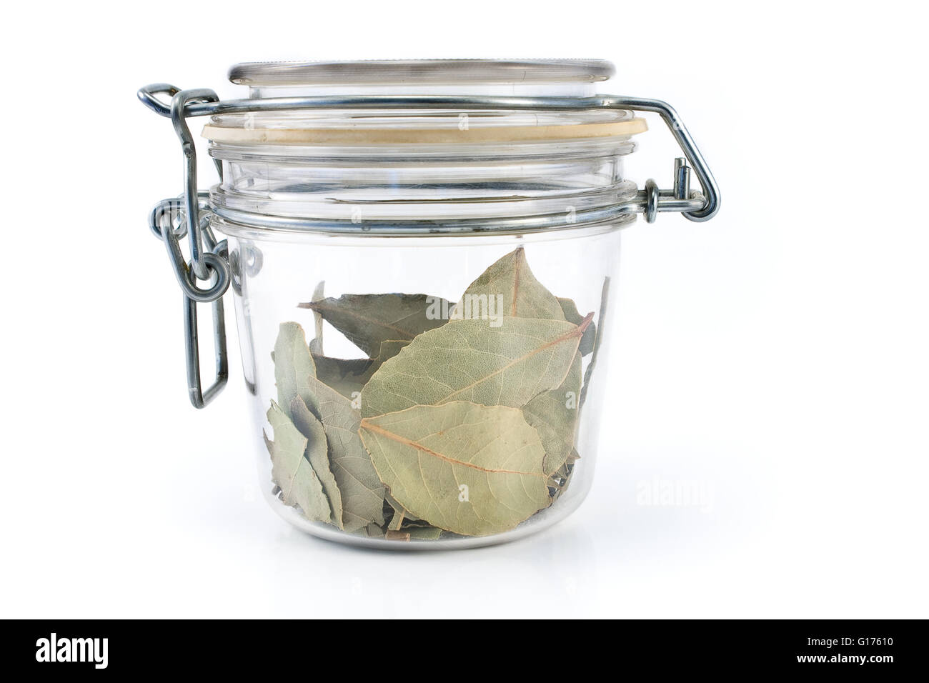 Dried bay leaves in jar isolated on white Stock Photo Alamy