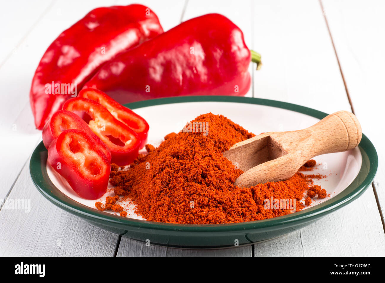 Powdered and fresh red paprika on wooden table Stock Photo Alamy