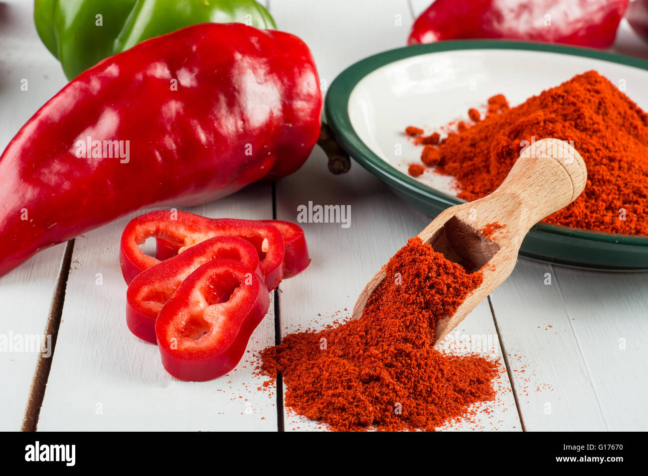Powdered and fresh red paprika on wooden table Stock Photo Alamy
