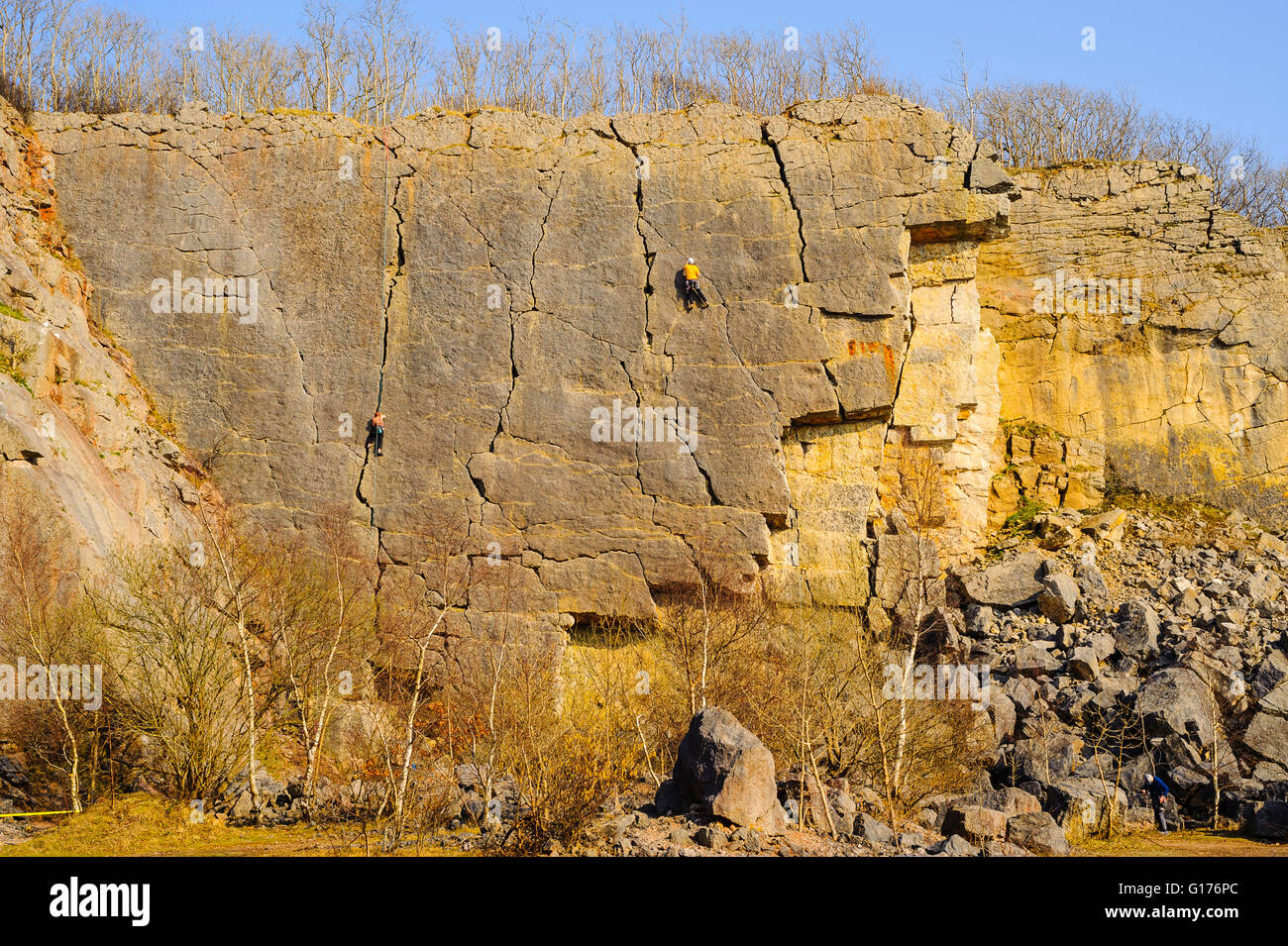 Rock-climbers on Main Wall at Trowbarrow Quarry near Silverdale Lancashire Stock Photo