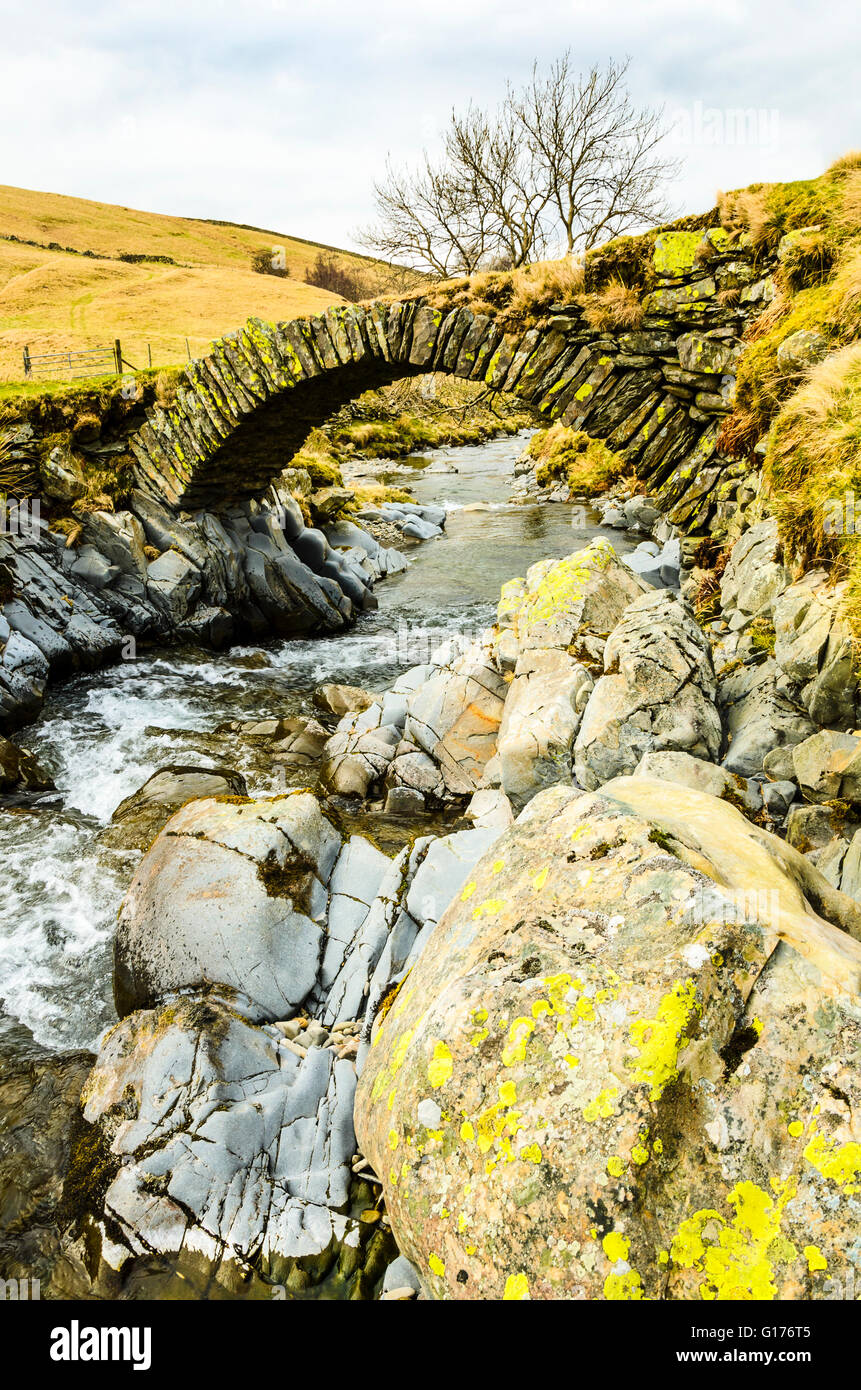 Packhorse bridge over Langdale Beck in the northern Howgill Fells Cumbria Stock Photo