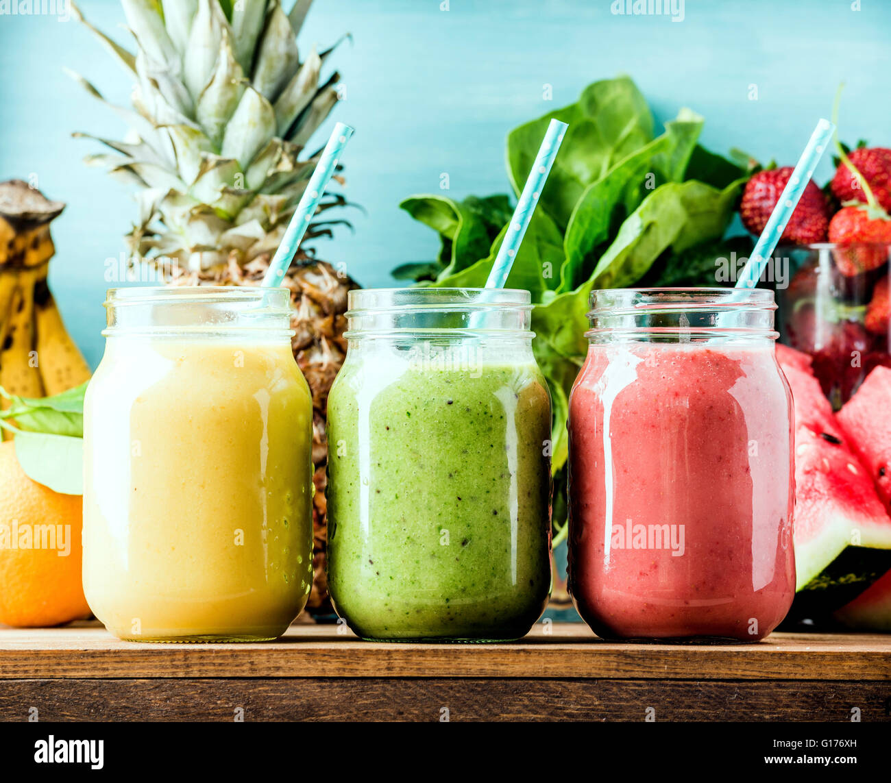 Freshly blended fruit smoothies of various colors and tastes in glass
