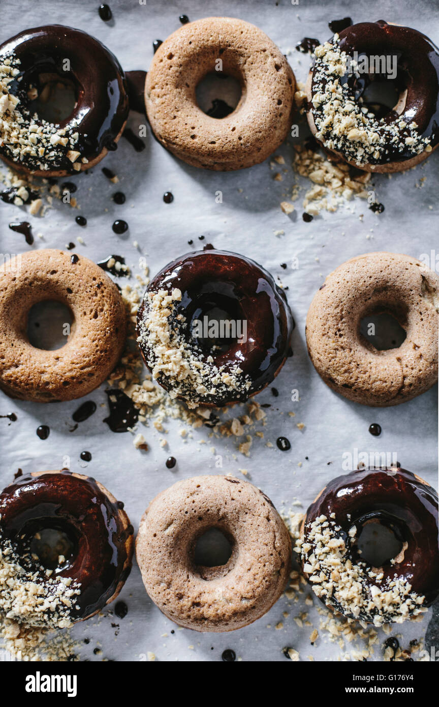 Chocolate Glazed Banana Bread Donuts are photographed from the top Stock Photo