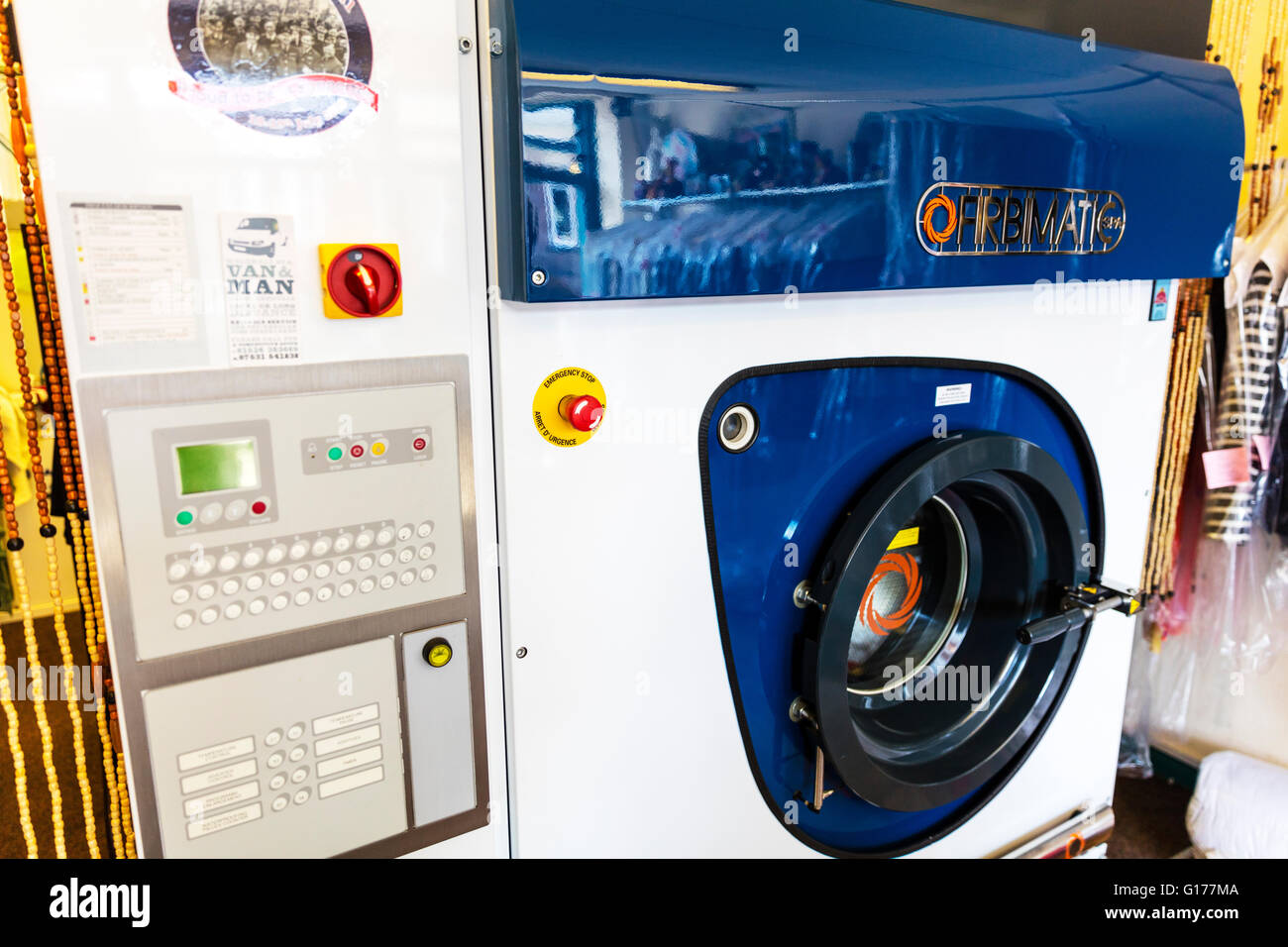 Dry cleaning machine dry cleaners Industrial washing machine UK England Stock Photo