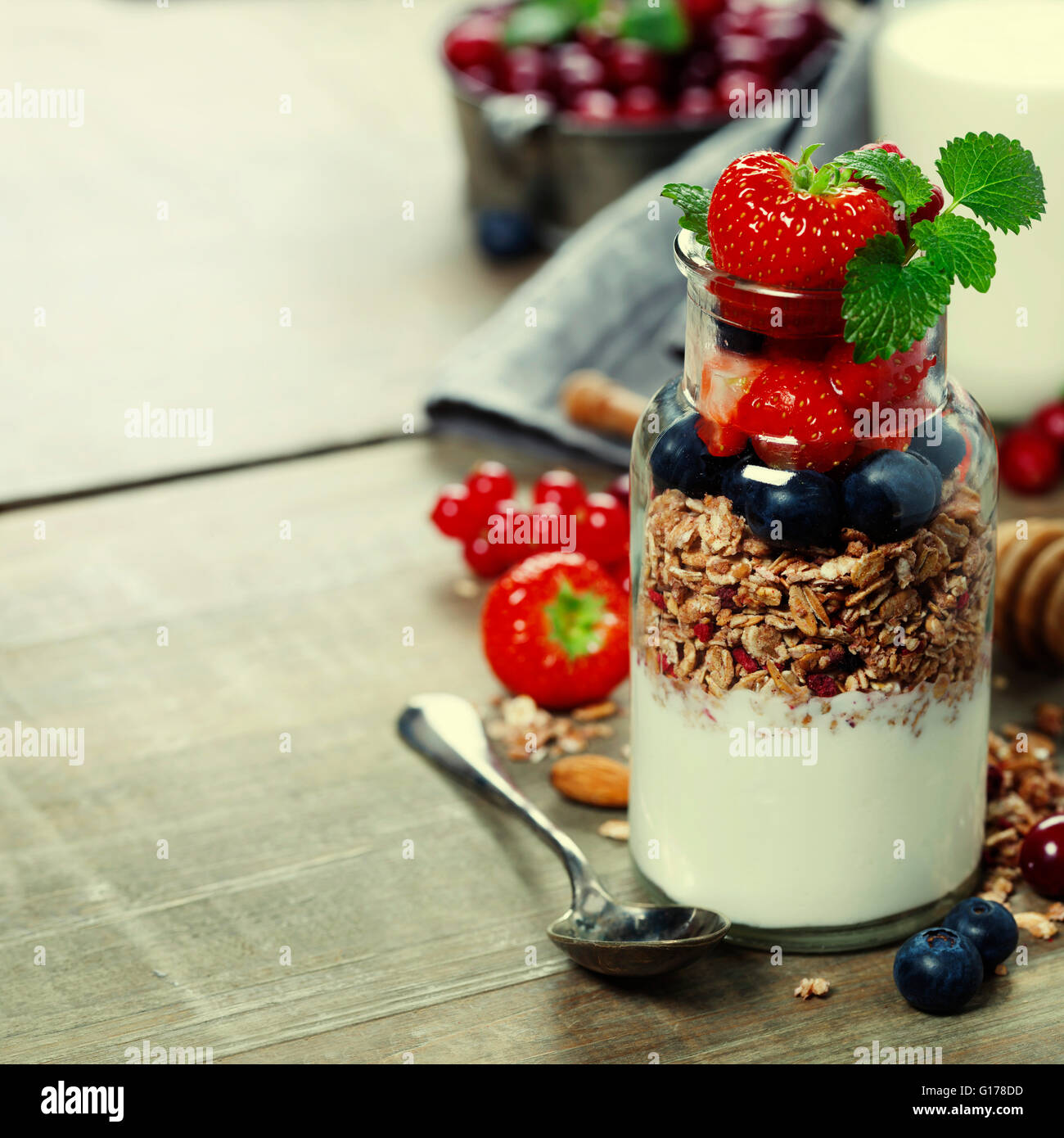 Yogurt with baked granola and berries - Healthy Breakfast concept Stock Photo