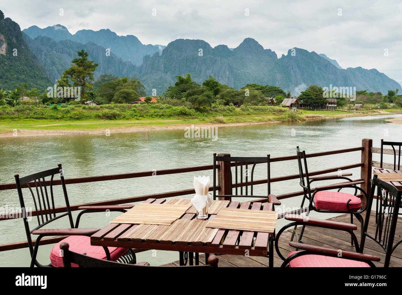 view of Nam Song River with Dining Table at Vang Vieng, Laos Stock Photo