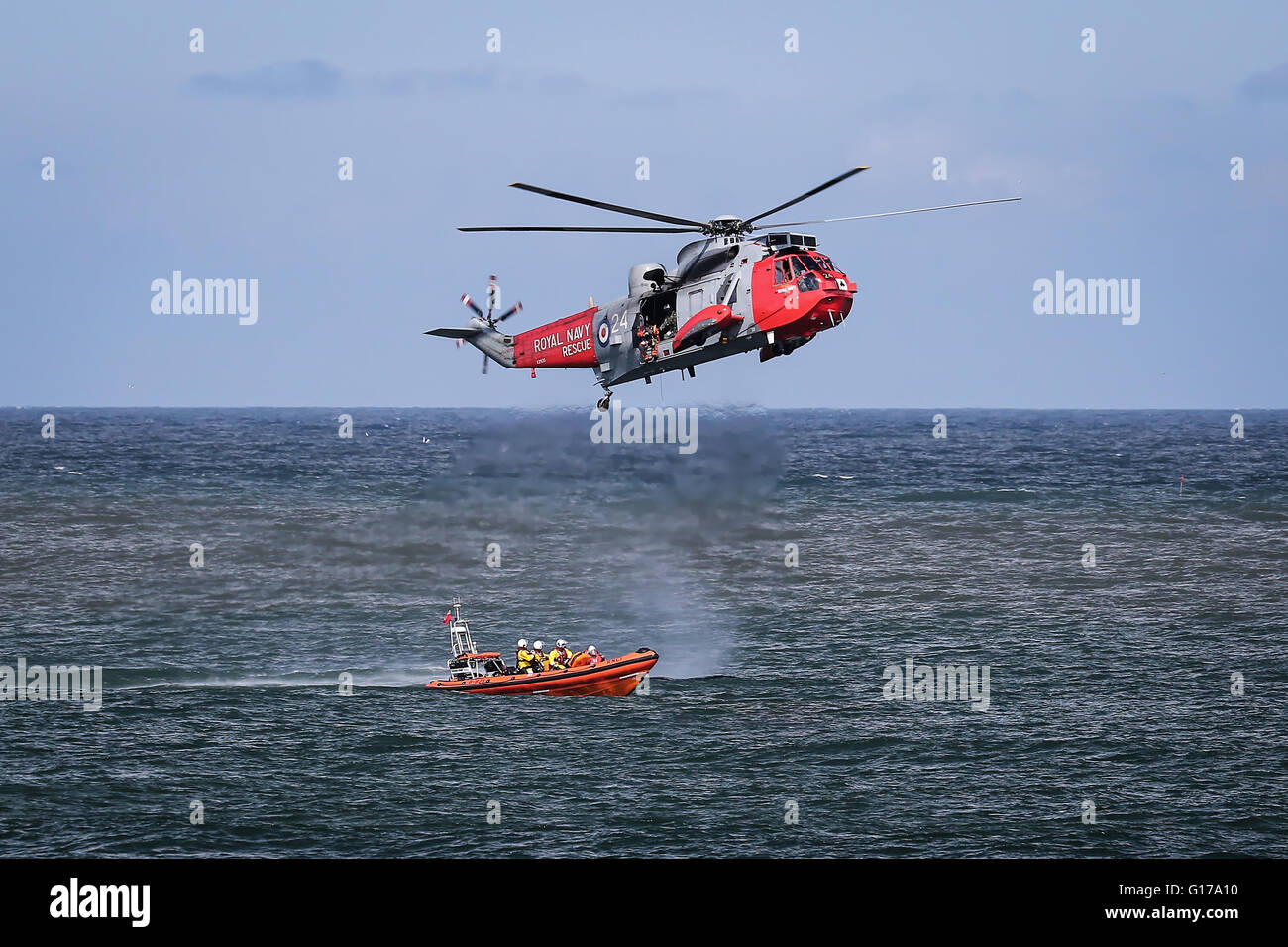 Helicopter performs rescue mission during air show Stock Photo
