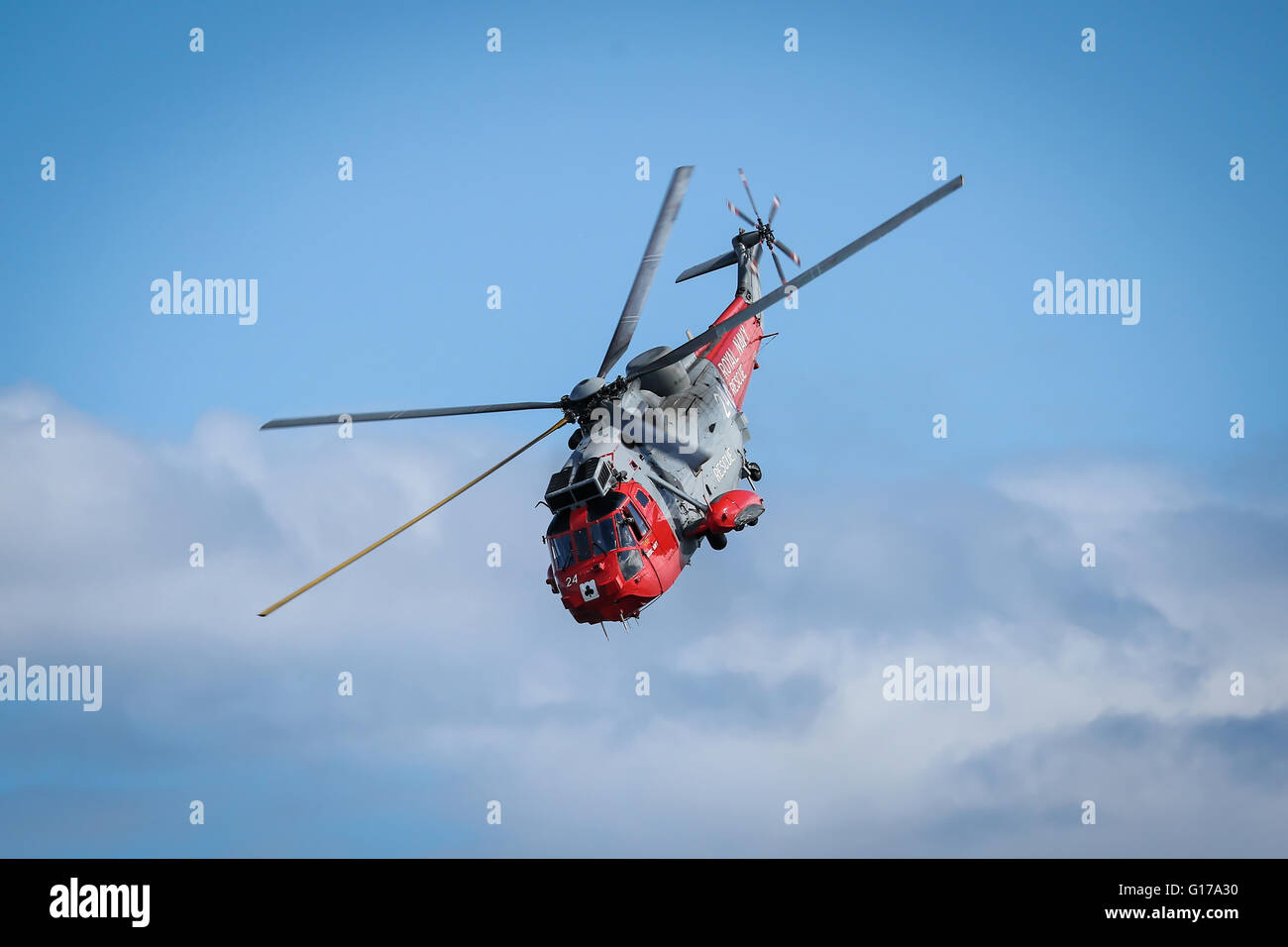 Helicopter performs rescue mission during air show Stock Photo