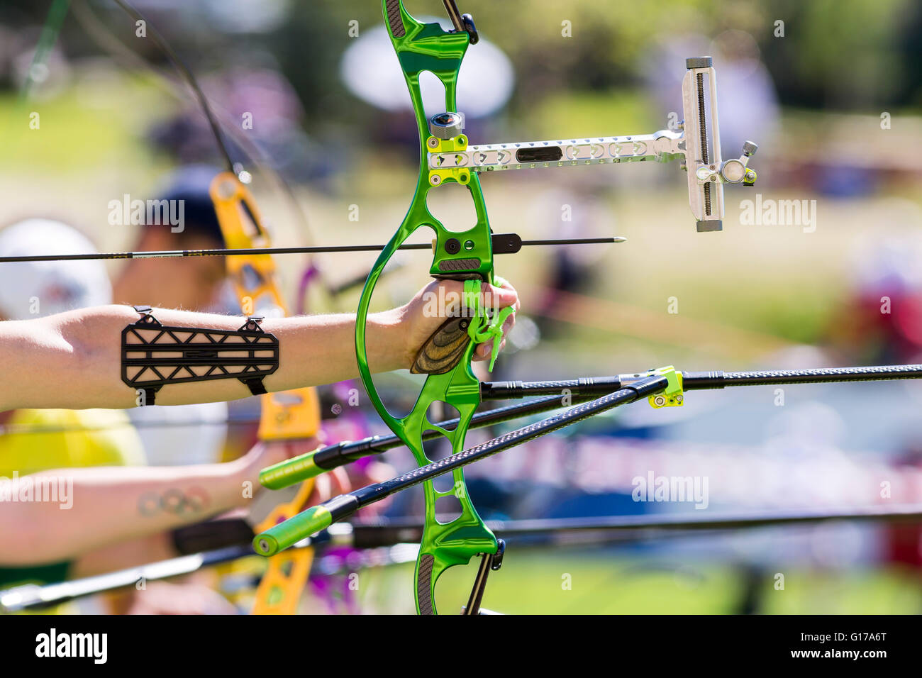 People are shooting with recurve bows during an archery competition