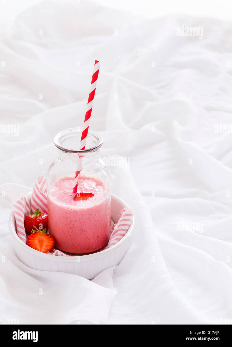 StrawberrySmoothie in a Milk Bottle Stock Photo