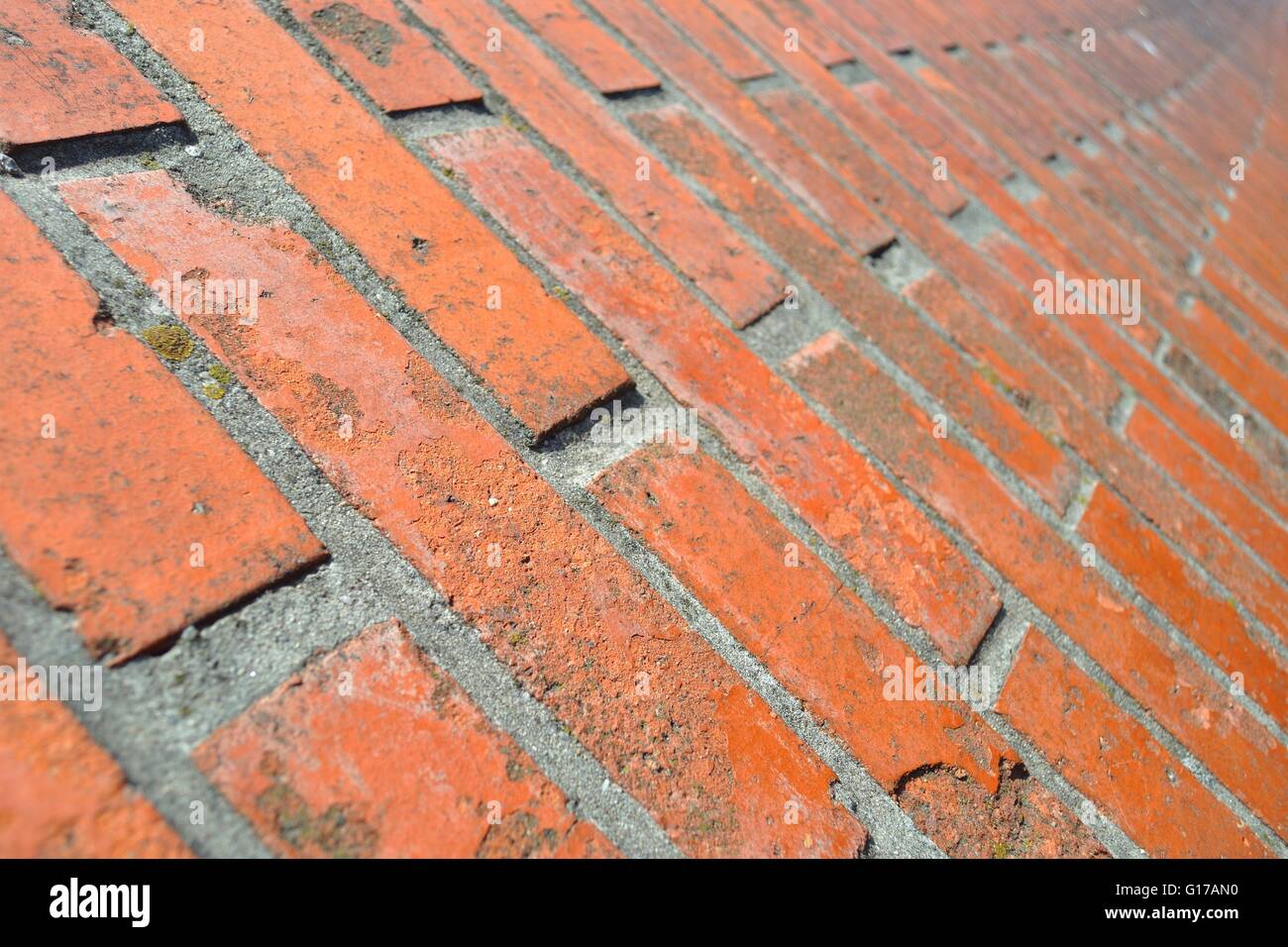 Brick wall in close up and in perspective. Selective focus Stock Photo