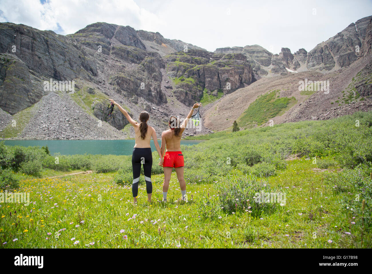 Women baring chest, Cathedral Lake, Aspen, Colorado Stock Photo