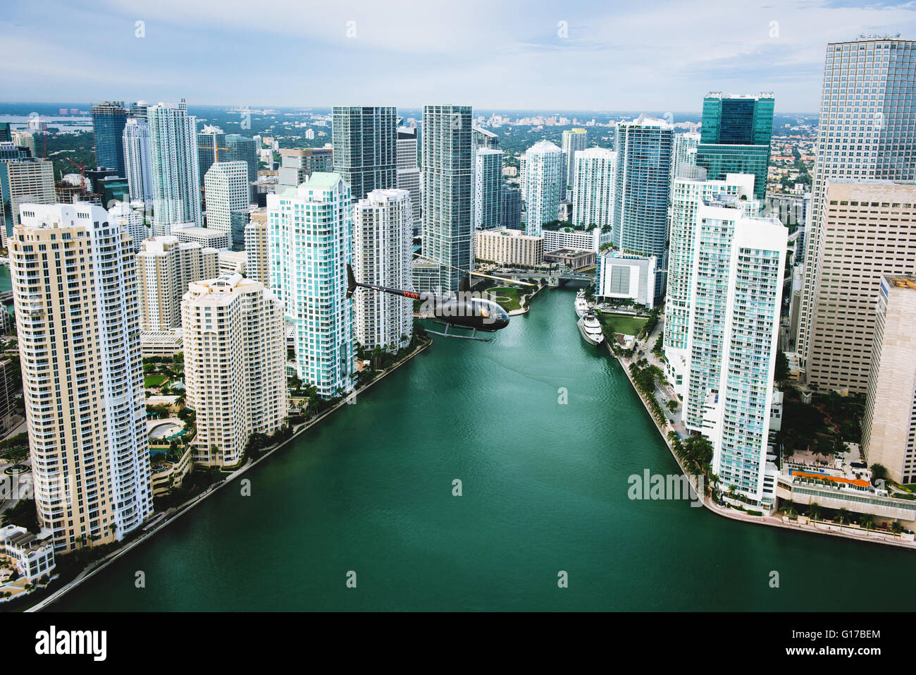 Skyscrapers and helicopter above Miami River, Brickell, Downtown Miami, Florida, USA Stock Photo