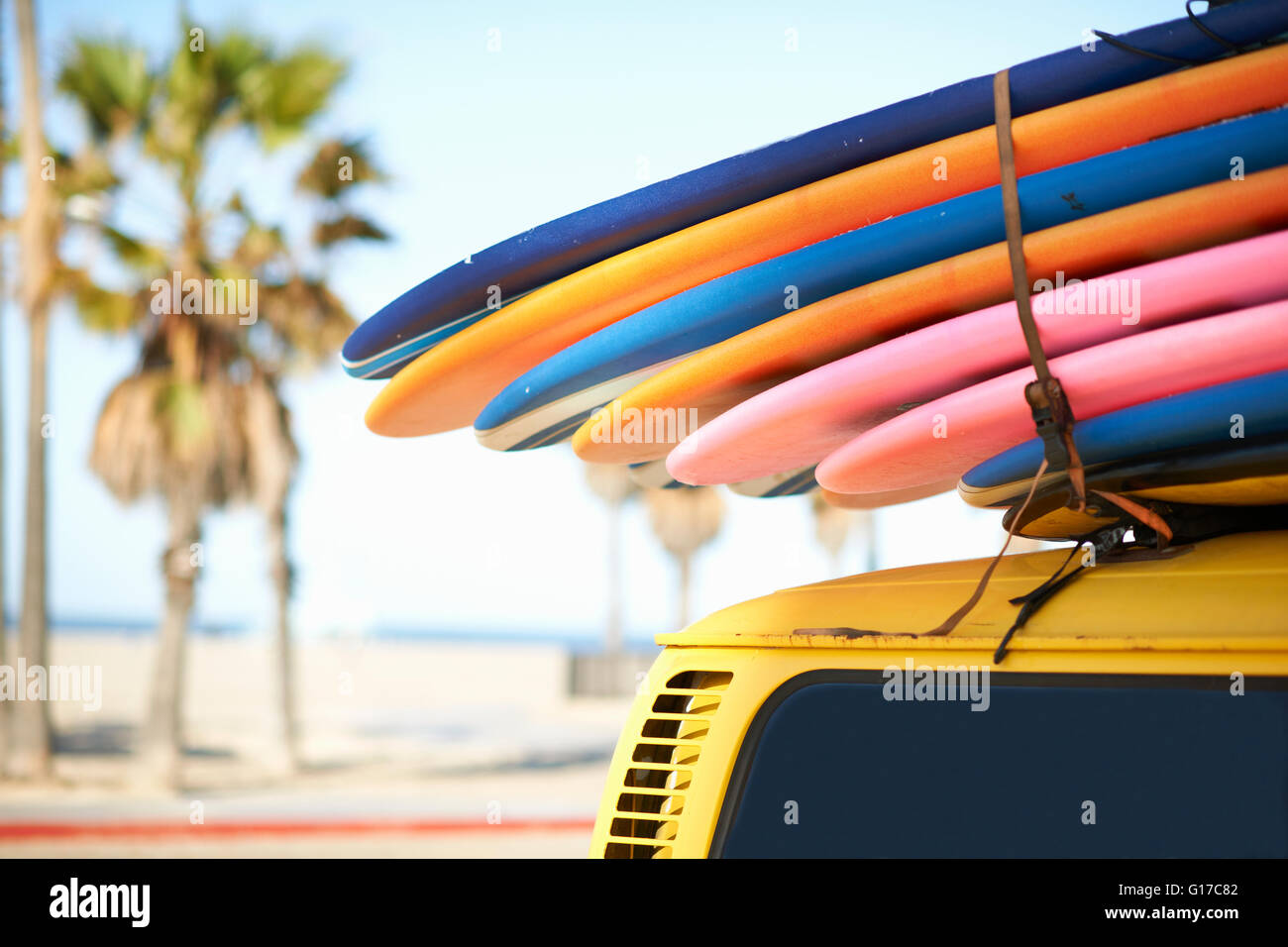 Multi-coloured surfboards tied onto vehicle, Venice Beach, Los Angeles, USA Stock Photo