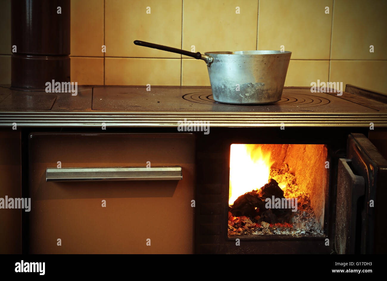 old woodburning stove in the kitchen of mountain home Stock Photo Alamy