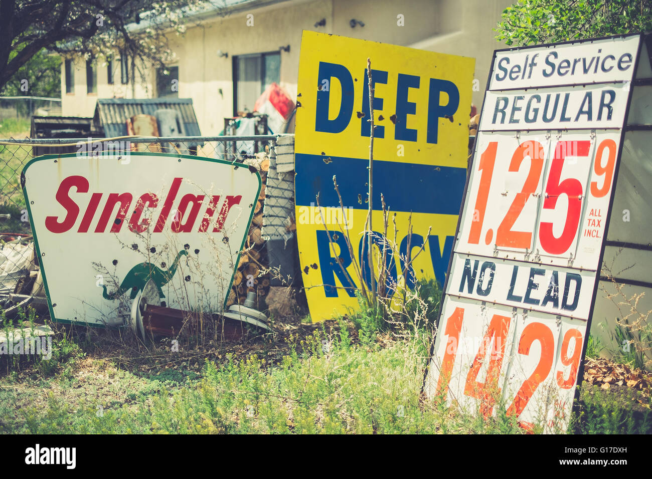 Vintage gas station signs on ground with cheap regular and no lead gas prices at the Classical Gas Museum, Embudo, New Mexico Stock Photo