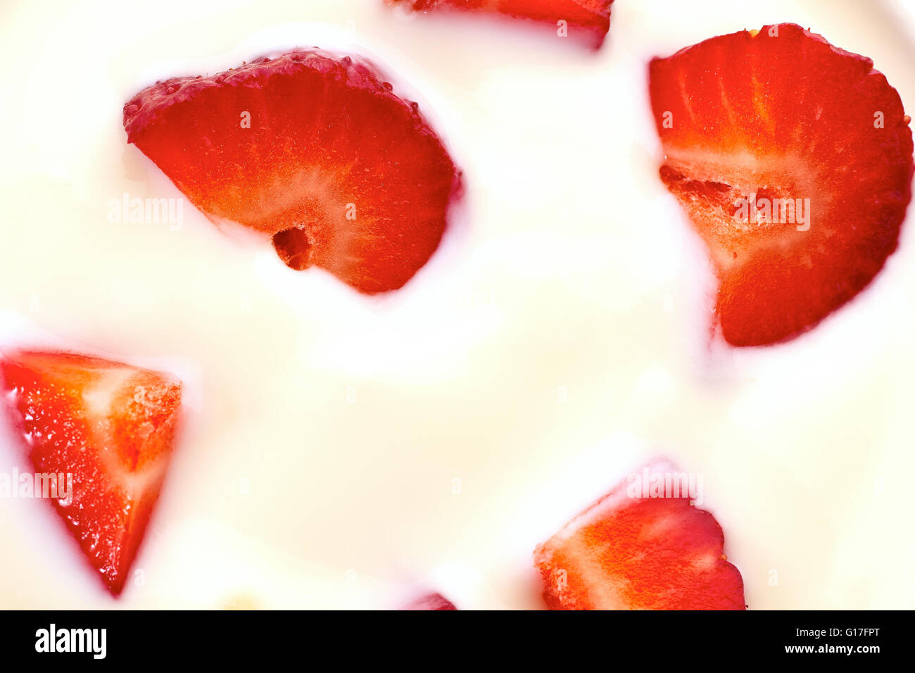 Sliced strawberries in yogurt Stock Photo