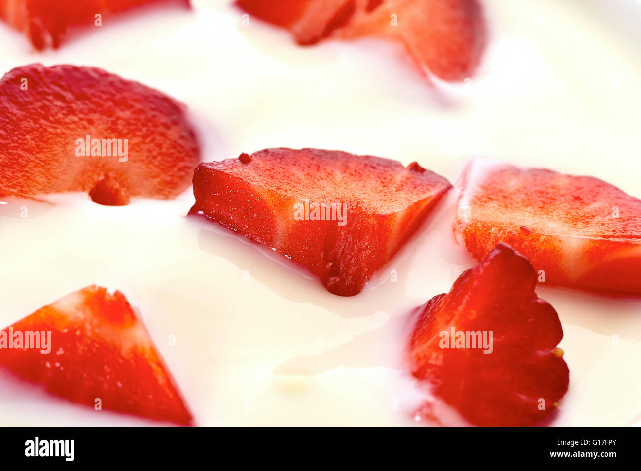 Sliced strawberries in yogurt Stock Photo