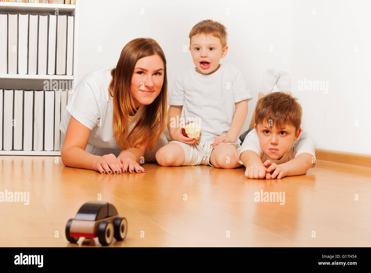 Mother playing with her sons at home Stock Photo Alamy