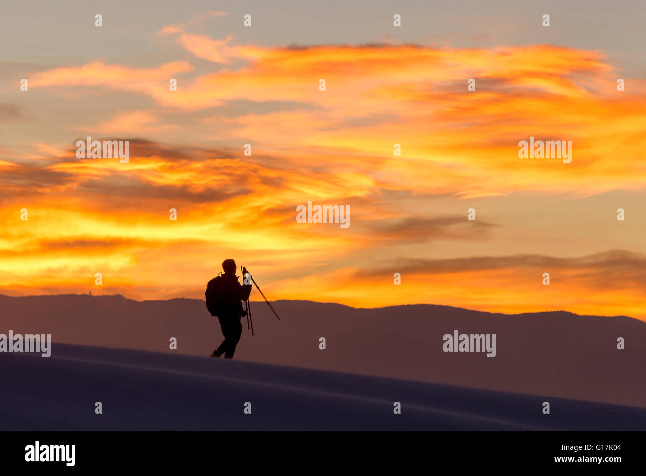 Photographer at sunrise, White Sands National Monument, New Mexico. Stock Photo