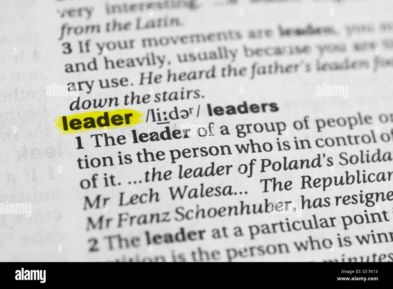 Detail of the english word "leader" highlighted and its definition from the dictionary Stock