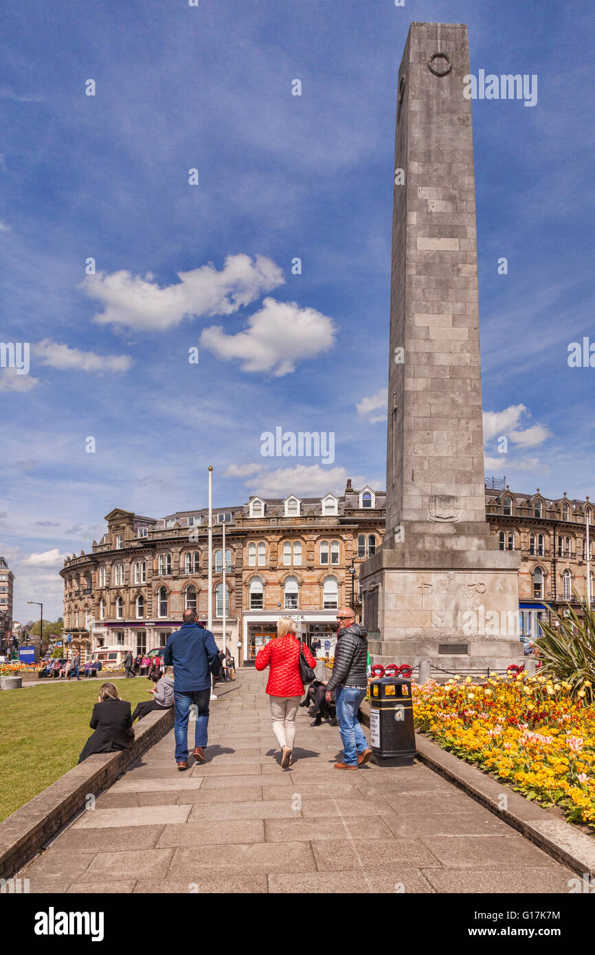 Group of people walking through gardens in the centre of Harrogate, North Yorkshire, England, UK Stock Photo