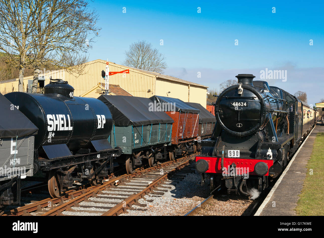 West Somerset Railway 2016 Spring Gala ex-BR 8F 48624 arriving at  Midford station (a renamed Washford) with a Minehead train Stock Photo