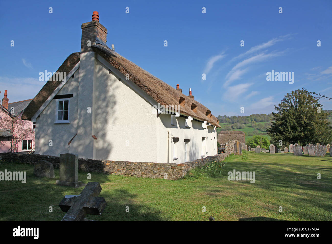 A  Devon Cottage in a rural village next to the village churchyard Stock Photo