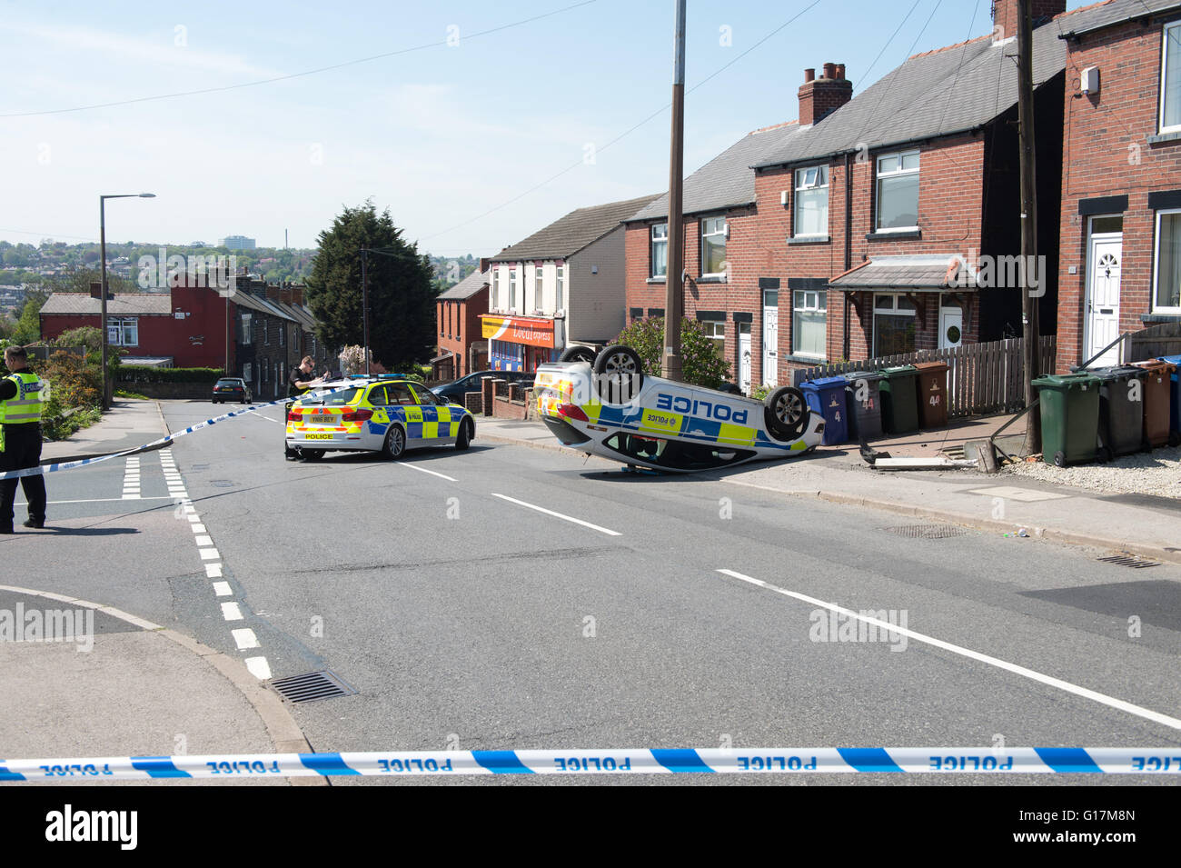 A police car rests on it roof after an RTA on Carlton Road in Barnsley ...