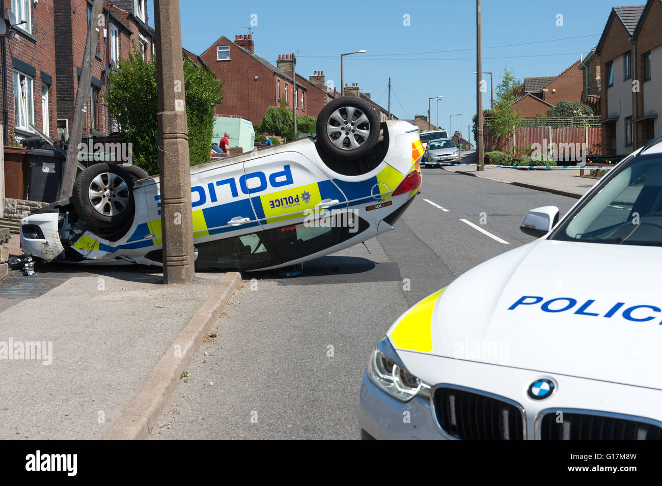 A police car rests on it roof after an RTA on Carlton Road in Barnsley ...