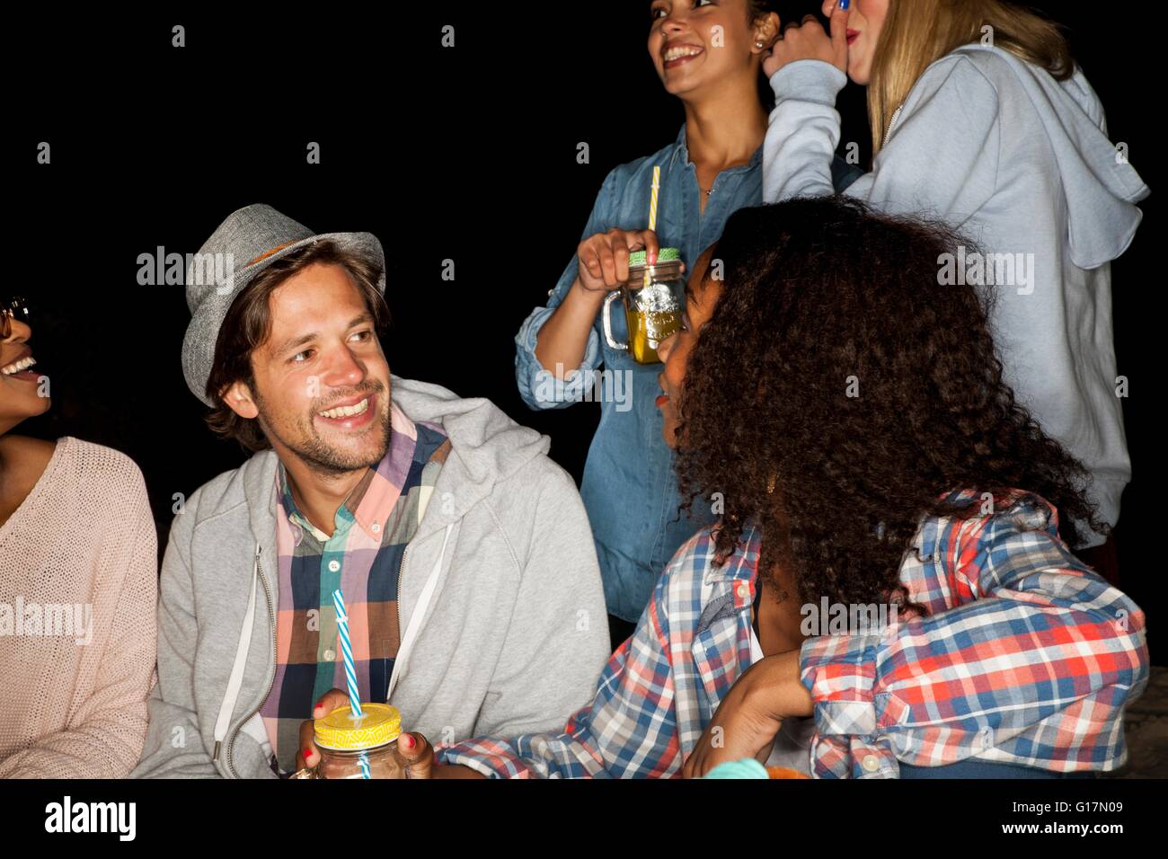 Group smiling friends holding hi-res stock photography and images - Alamy