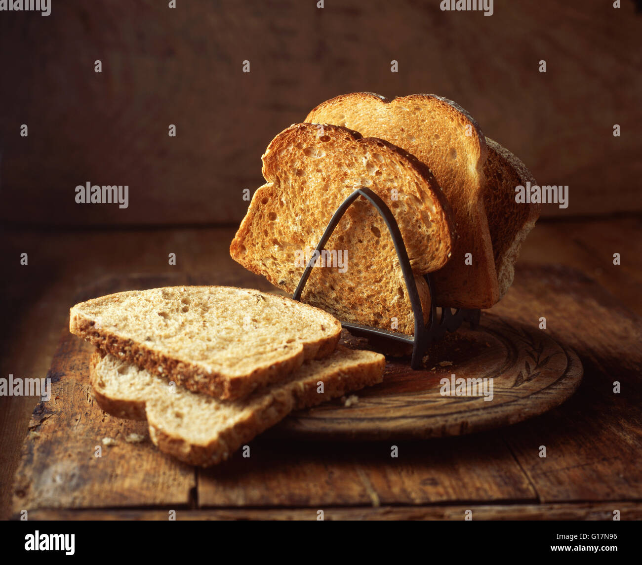 White and brown toast in toast rack, close-up Stock Photo