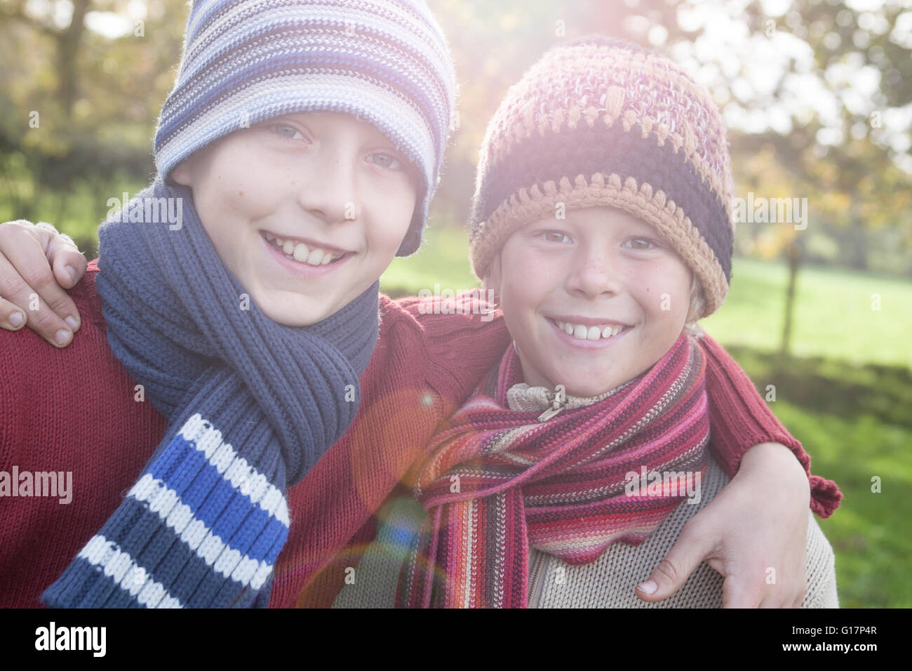 Portrait of two boys in park, smiling Stock Photo - Alamy