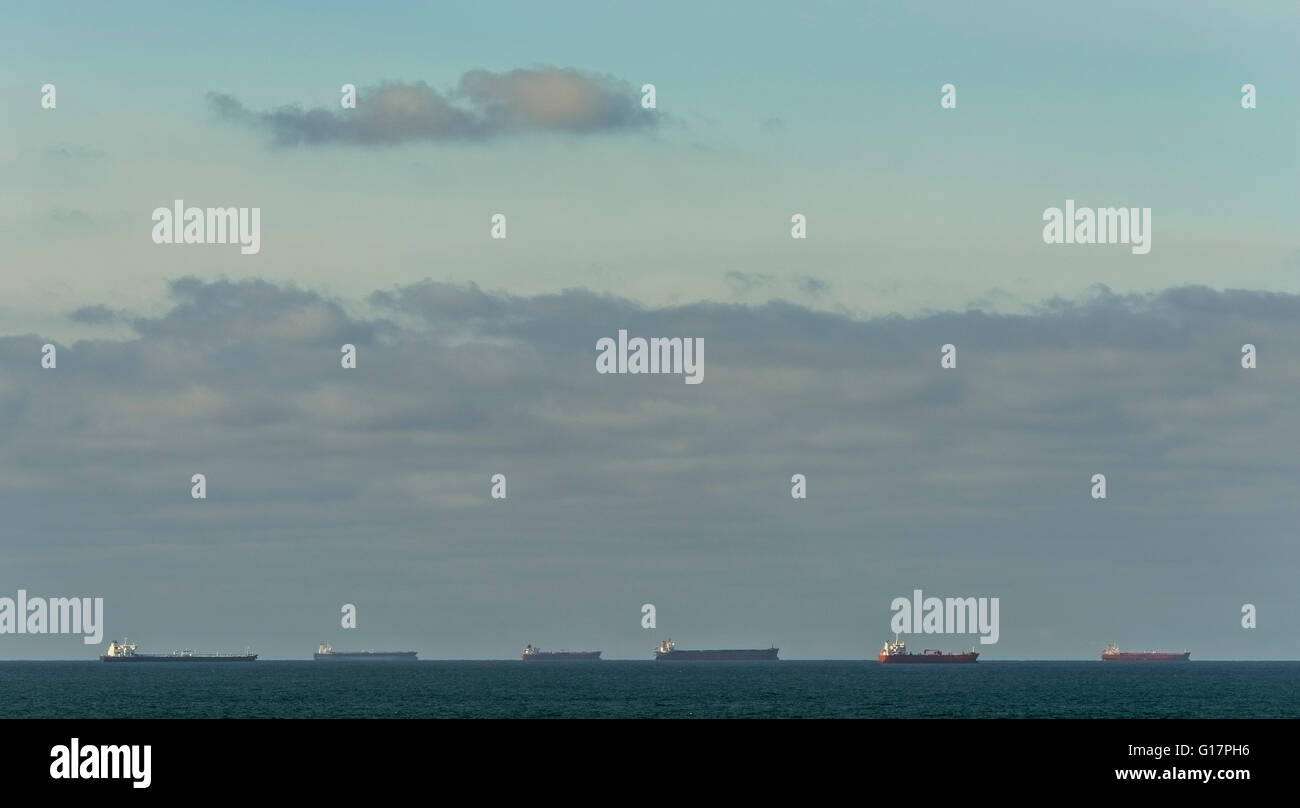 Row of oil tankers anchored in north sea waiting for oil prices to rise before unloading at Rotterdam harbour, Netherlands Stock Photo