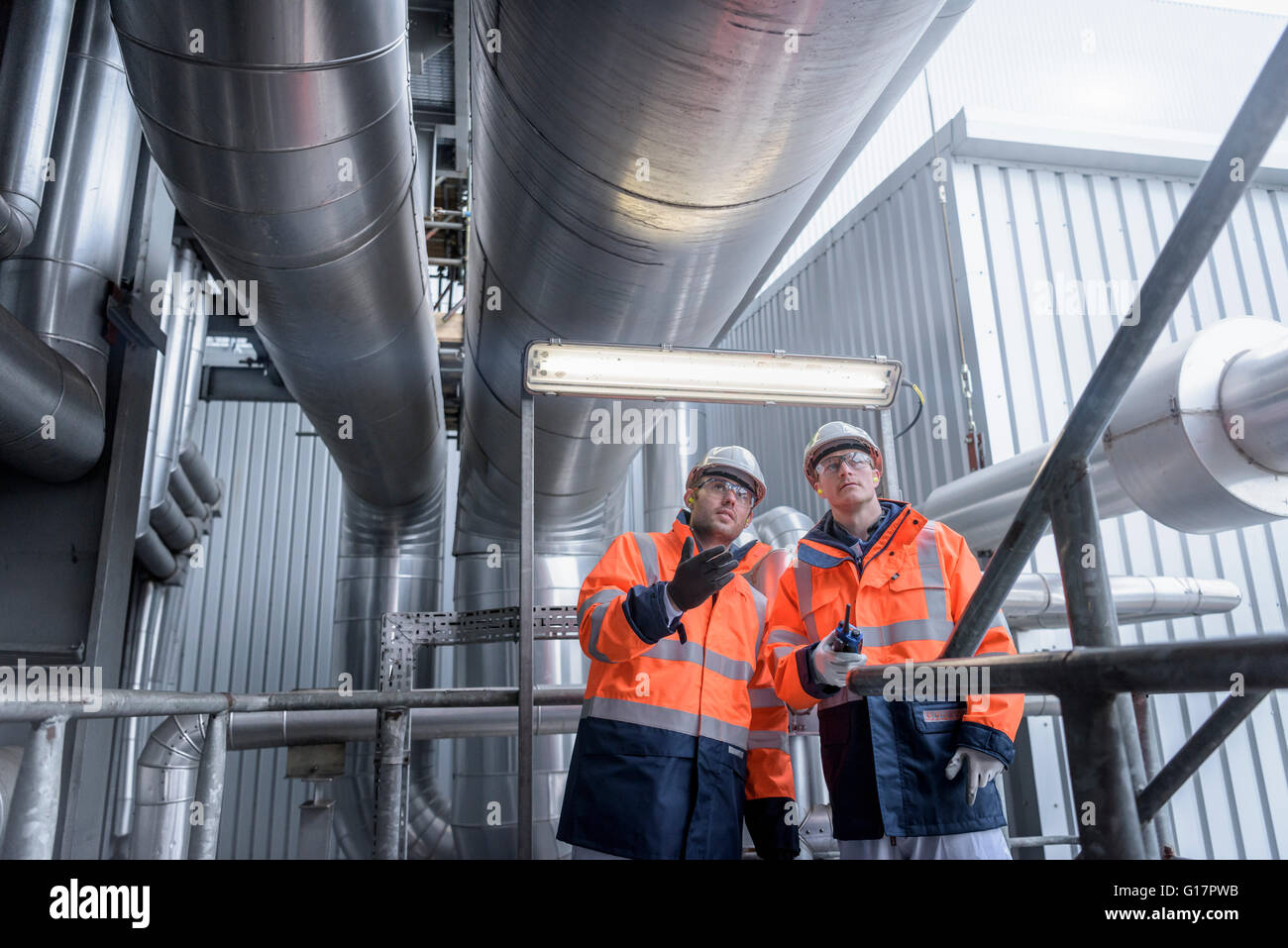 Workers in gas-fired power station Stock Photo