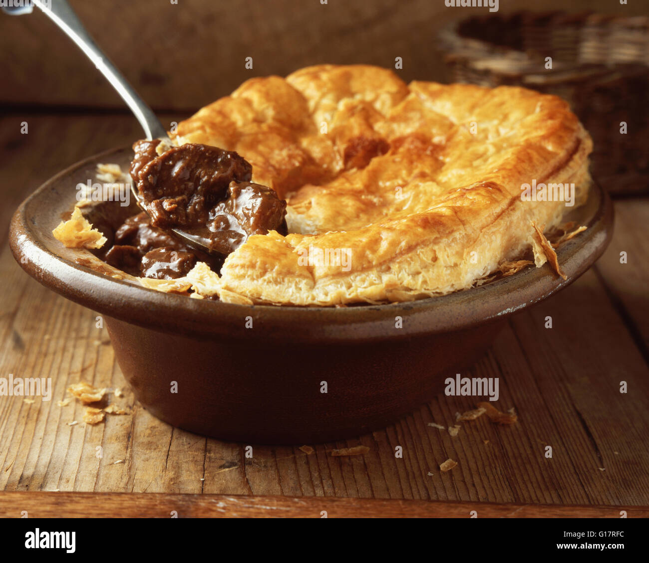 Beef and ale puff pastry pie in oval dish Stock Photo