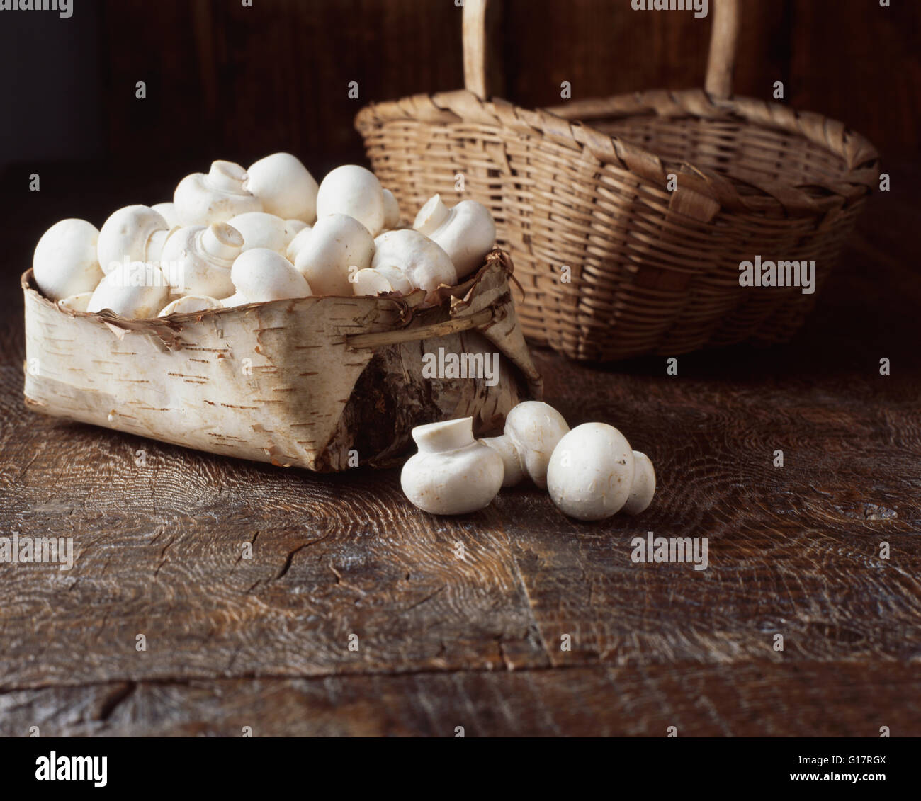 Mushrooms in vintage wooden basket Stock Photo